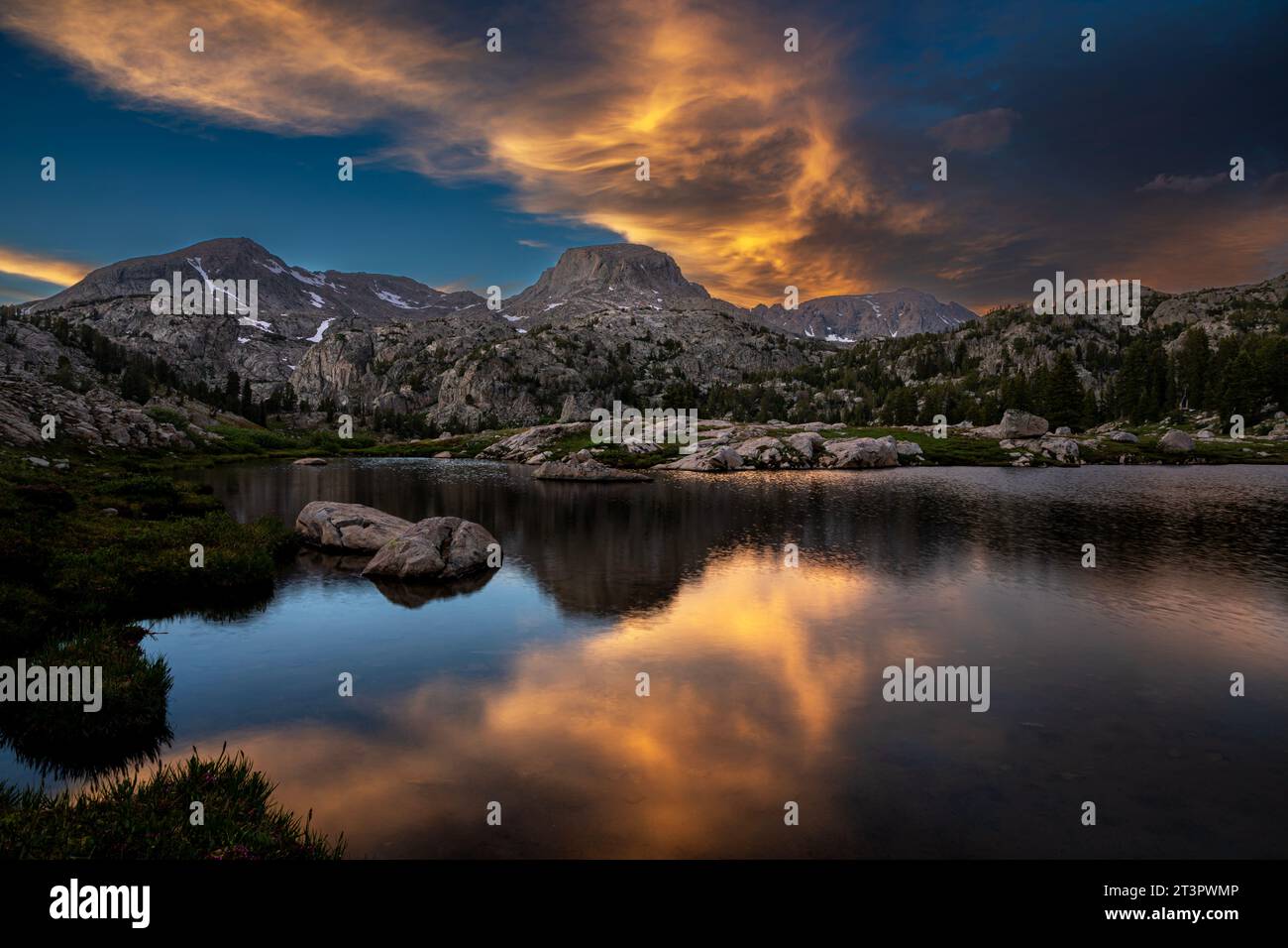 WY0534000...WYOMING Sunset at a small lake below Gunsight Pass on