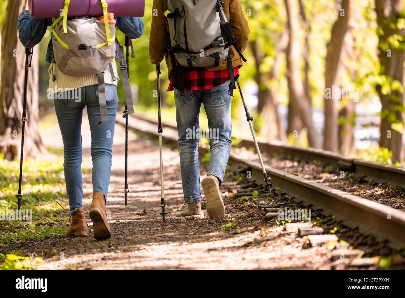 Young couple having a walk in the park Stock Photo - Alamy