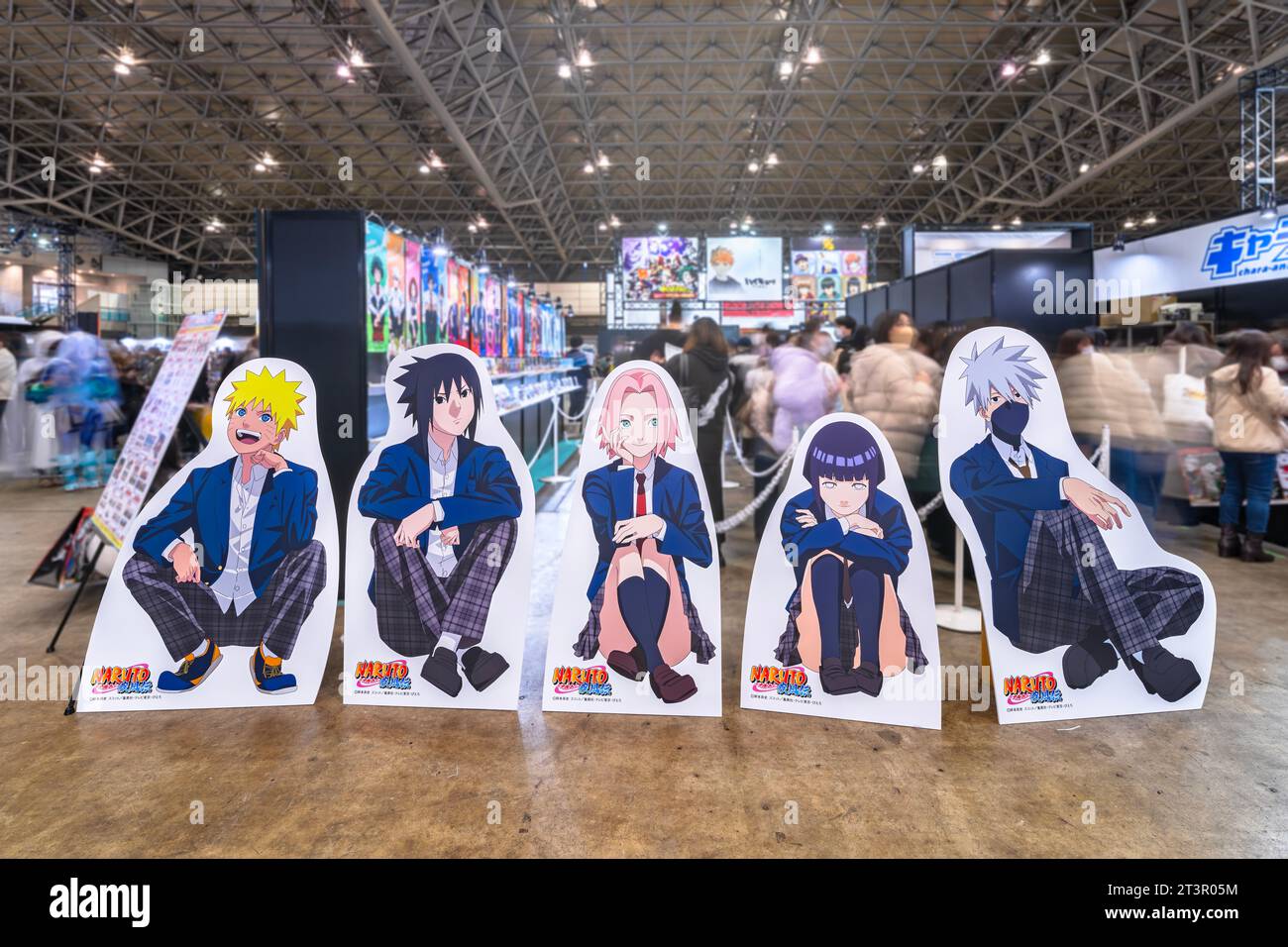 chiba, japan - dec 18 2022: Life sized standee featuring the manga heroes of Naruto Shippuden in school uniforms sitting on the floor of Jump Festa Stock Photo
