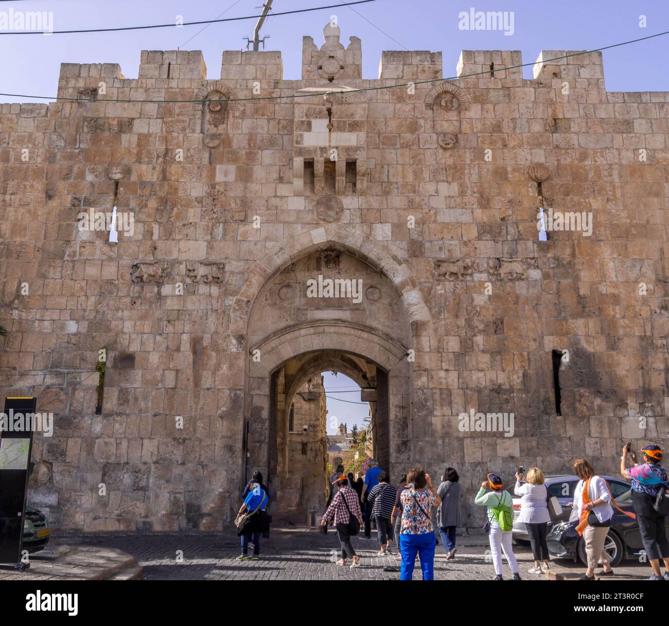 The tourists at Lion's gate, the medieval stone entrance to the Old Town of Jerusalem in Israel. Stock Photo