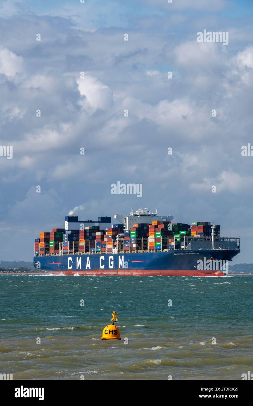 large fully loaded container ship in the solent off of the port of southampton docks in the uk. Stock Photo