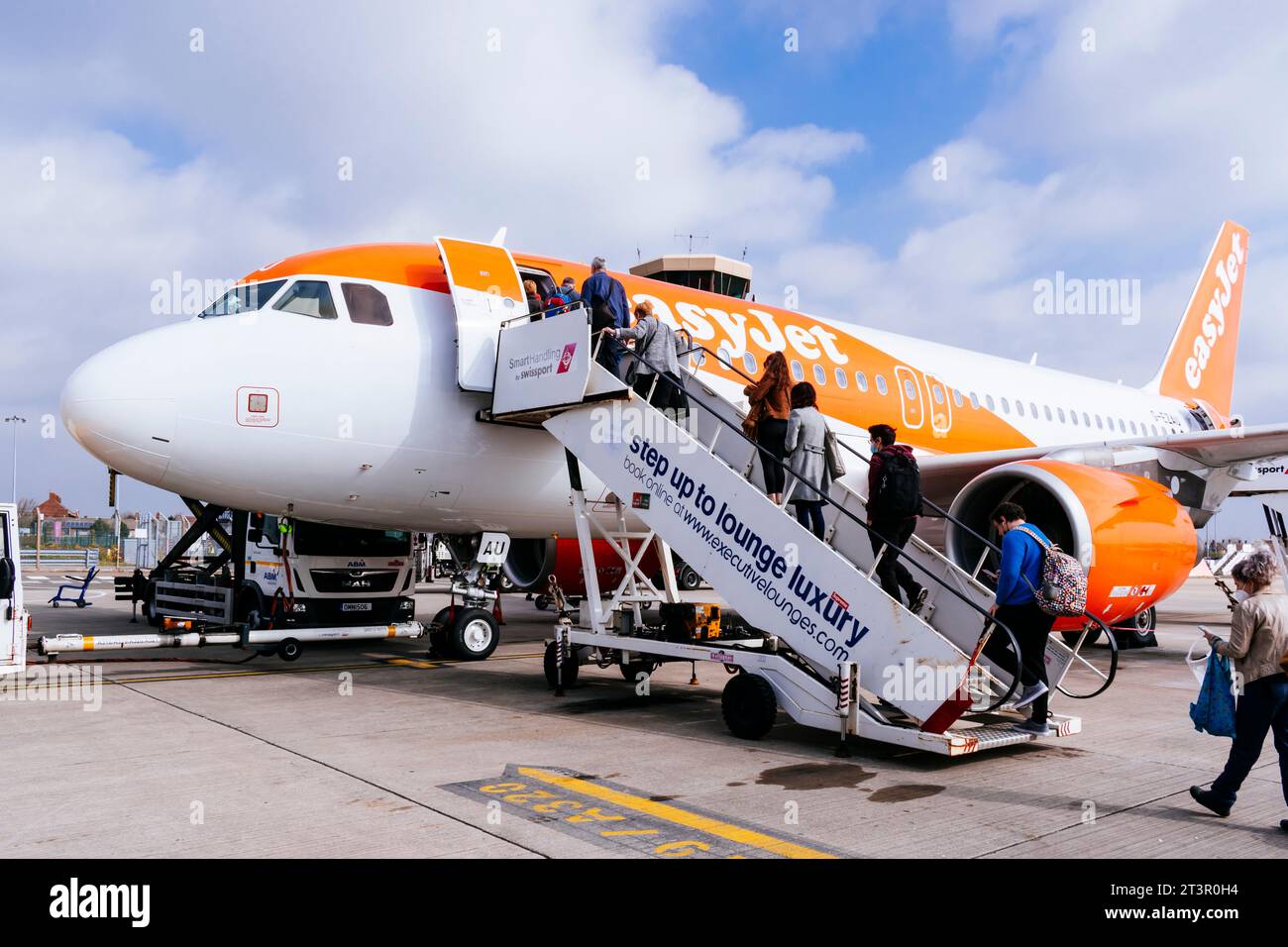 Passengers boarding an EasyJet plane. Liverpool, Merseyside, Lancashire, England, United Kingdom, Europe. Stock Photo
