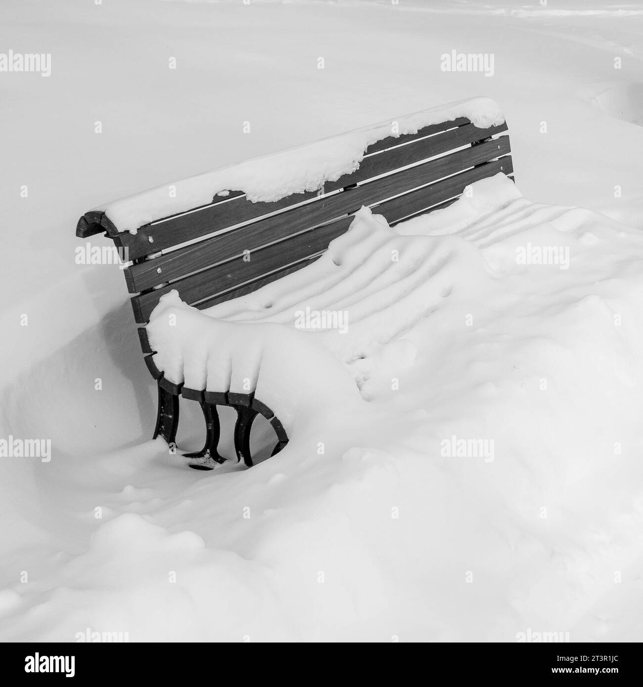 A bench under the snow, in LaFontaine Park, on the Mont-Royal plateau, in Montreal, province of Quebec, Canada. Stock Photo