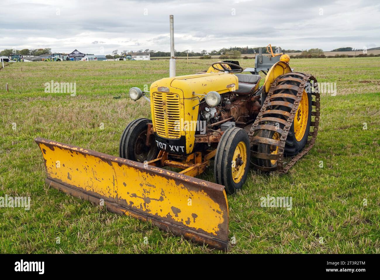 Ferguson 35 tractor, register number 707 XVT, fitted with front snow plough attachment and metal caterpillar tracks, on display Stock Photo