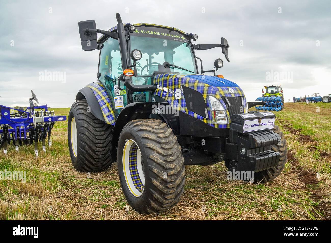 New Holland T4.75 tractor, decorated in the MND, My Name's Doddie Foundation tartan, a charity set up in the name of Doddie Weir, on display Stock Photo