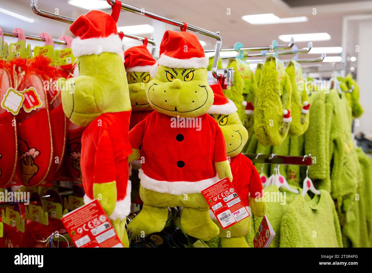 Primark Grinch children's fashions items in Primark store Torquay - The Grinch hot water bottle Stock Photo