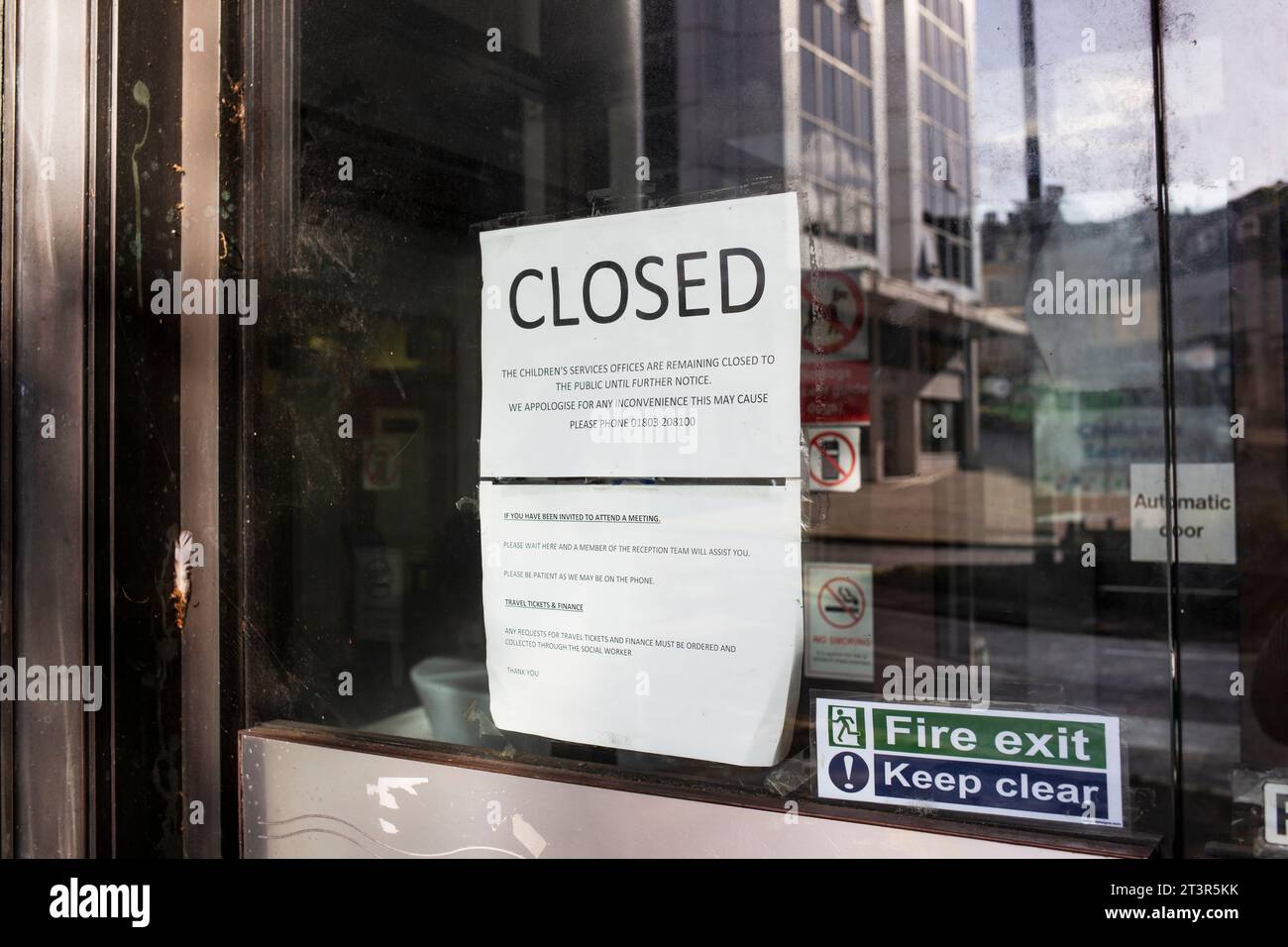 Connections building CLOSED paper sign on front glass door Stock Photo