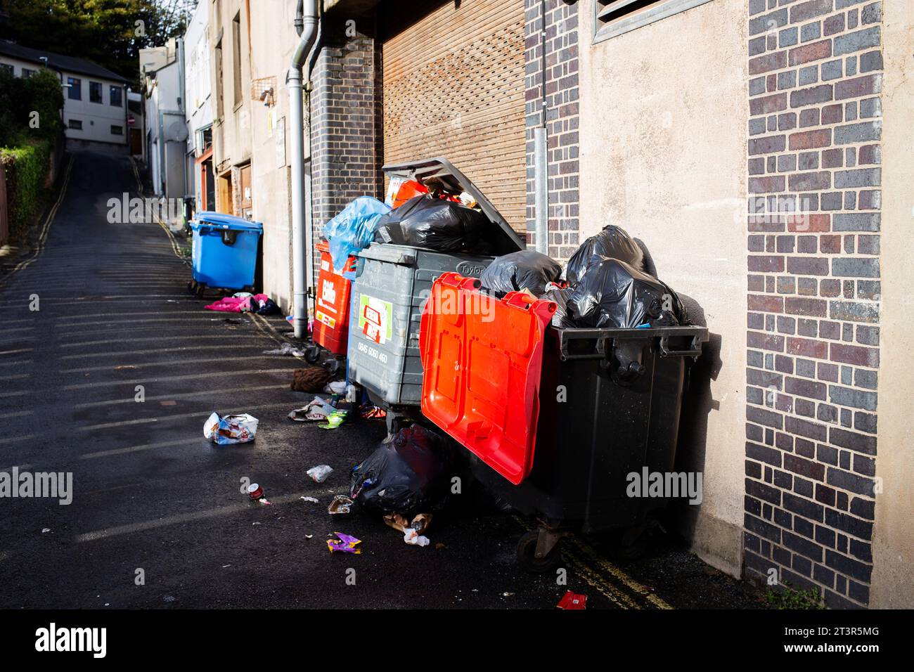overflowing open rubbish bins on Lower Union Lane in Torquay Stock