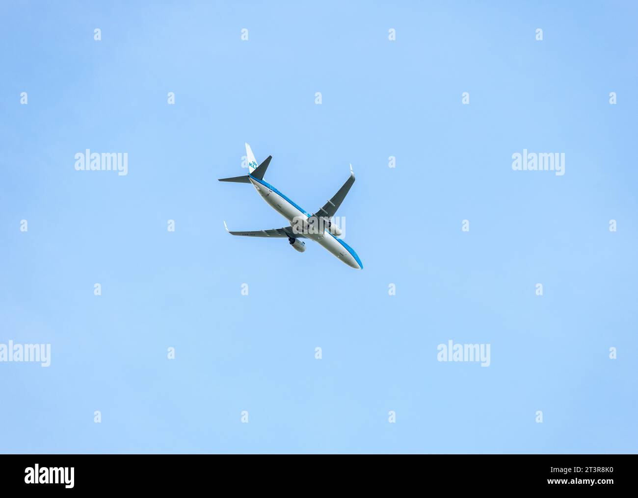 KLM passenger airplane flying across a blue sky Stock Photo - Alamy