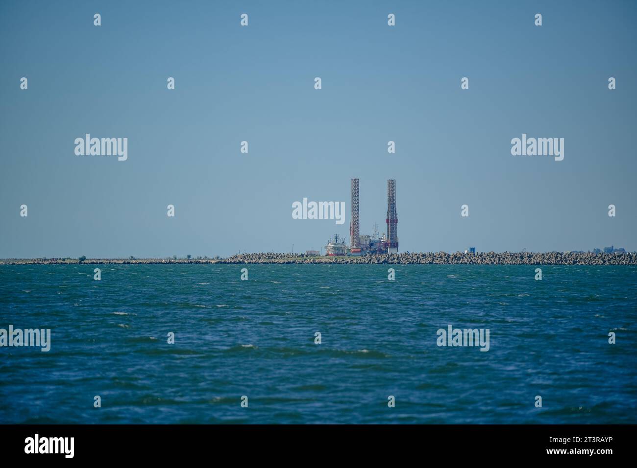 View showing an oil rig moored at a commercial dock Stock Photo - Alamy