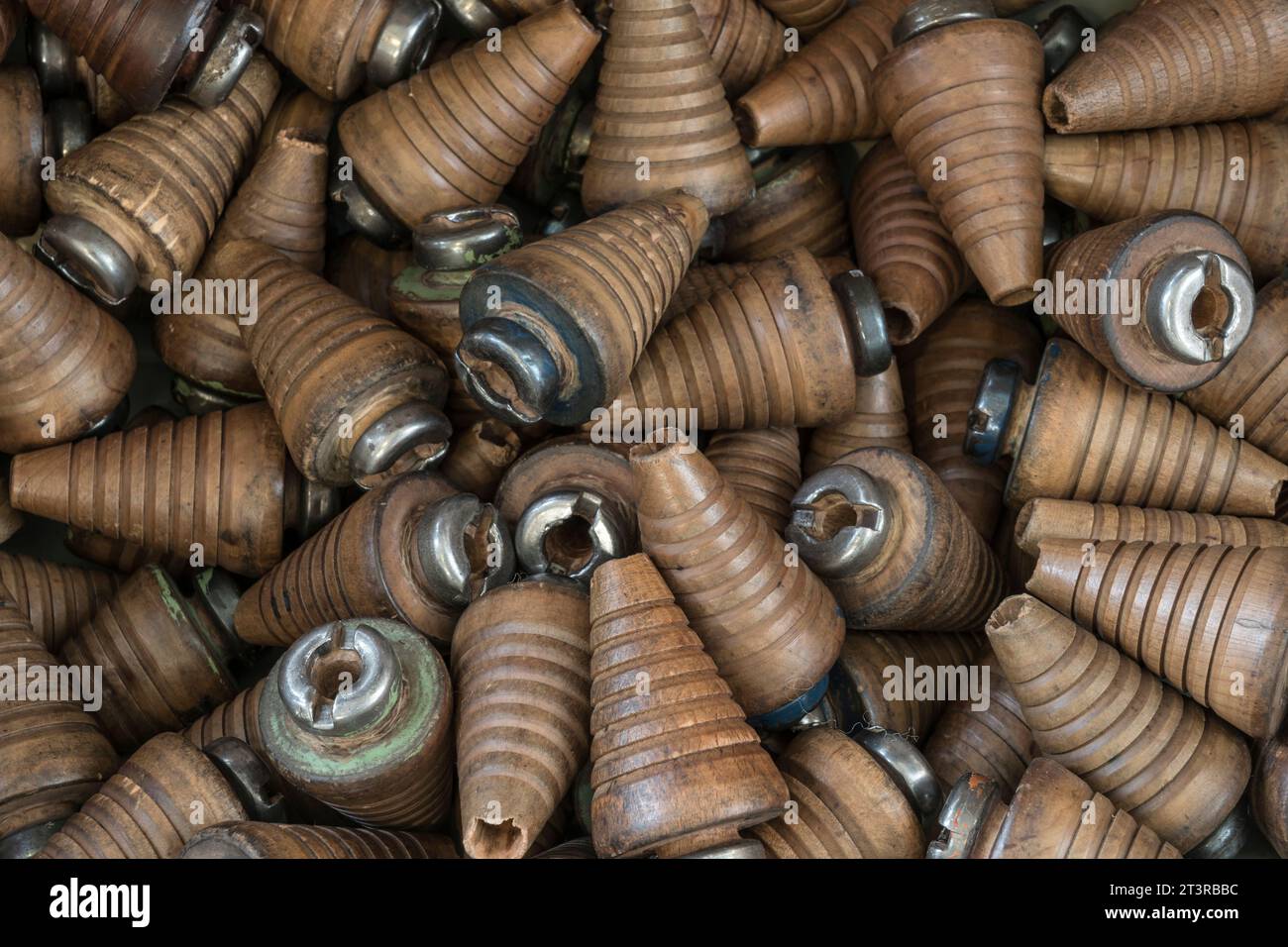 thread spools for weaving in an old textile mill Stock Photo