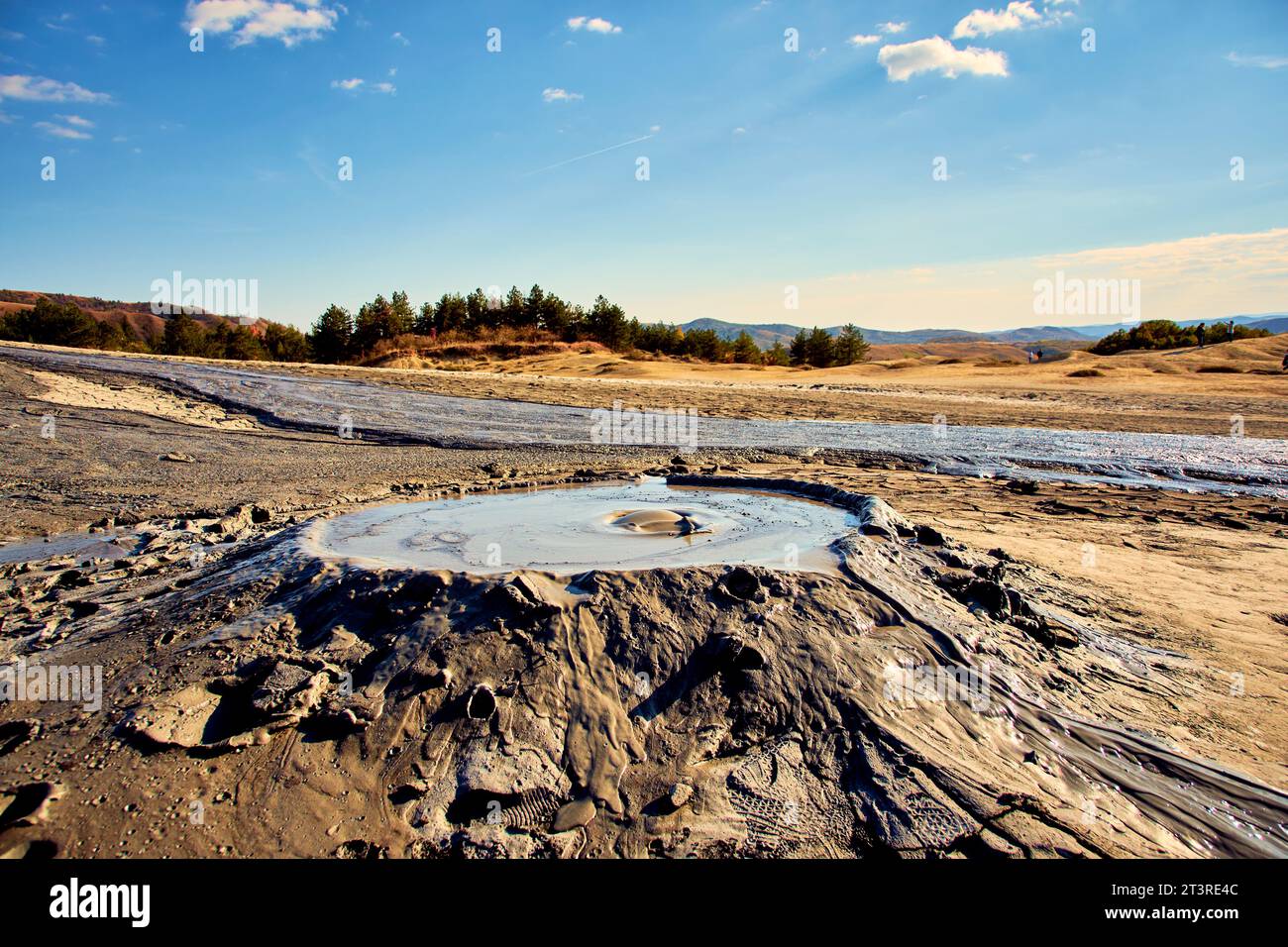 cones of mud volcanoes from which rivers of mud flow Stock Photo