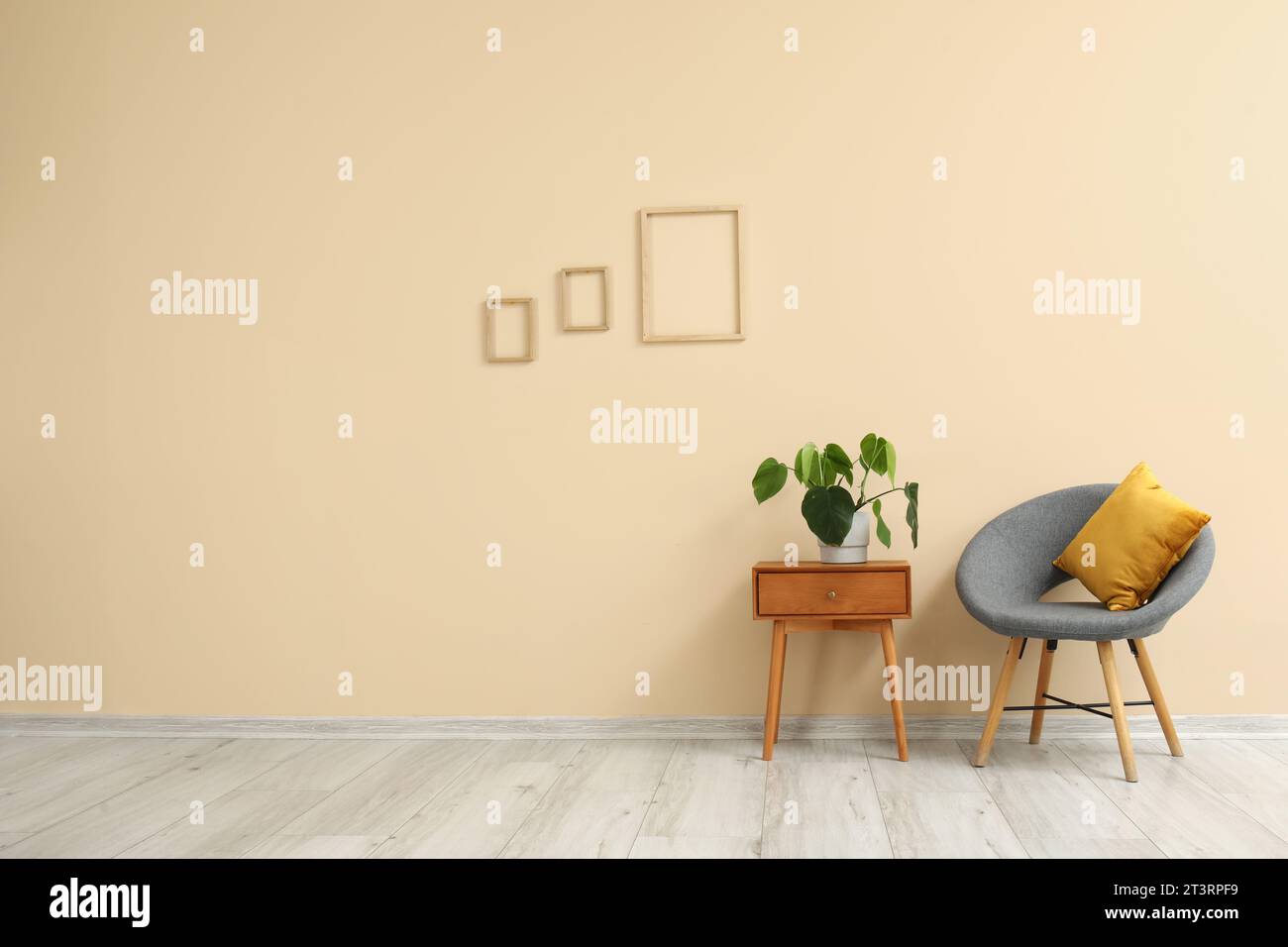 Interior of living room with armchair and table Stock Photo - Alamy