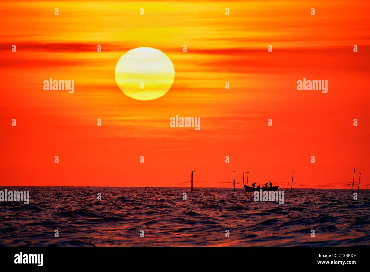 sunrise with a fishing boat on the Black Sea Stock Photo - Alamy