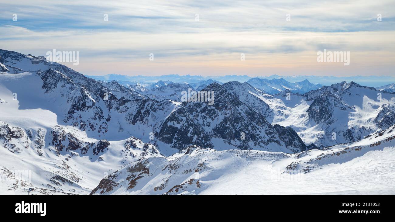Stubai Glacier Alps mountain snowy range in the background of cloudy sky Stock Photo