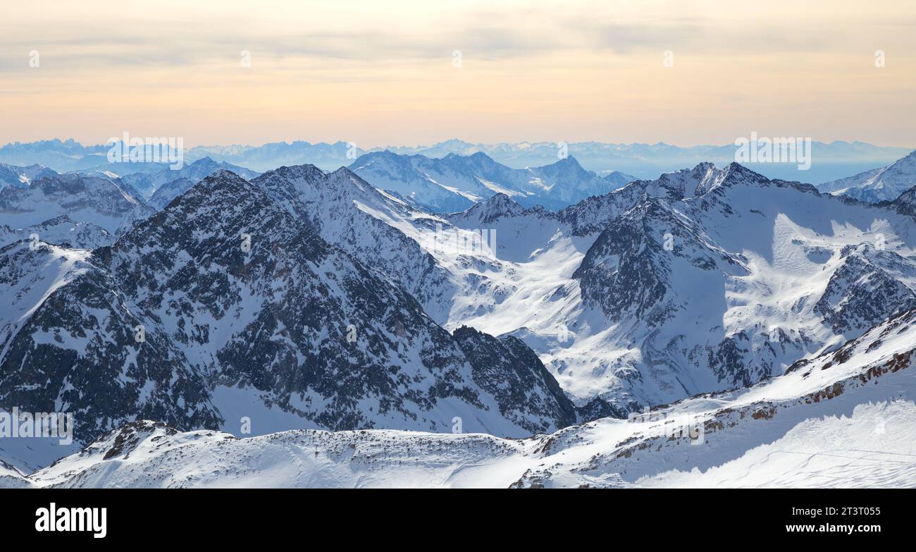Stubai Glacier Alps mountain snowy range in the background of cloudy sky Stock Photo