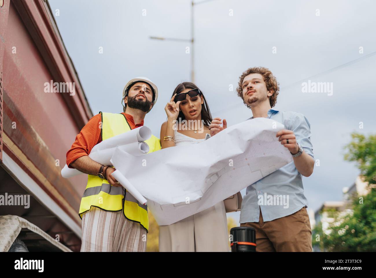 Collaborative Architectural Team Strategizing Sustainable Design for New Project Stock Photo