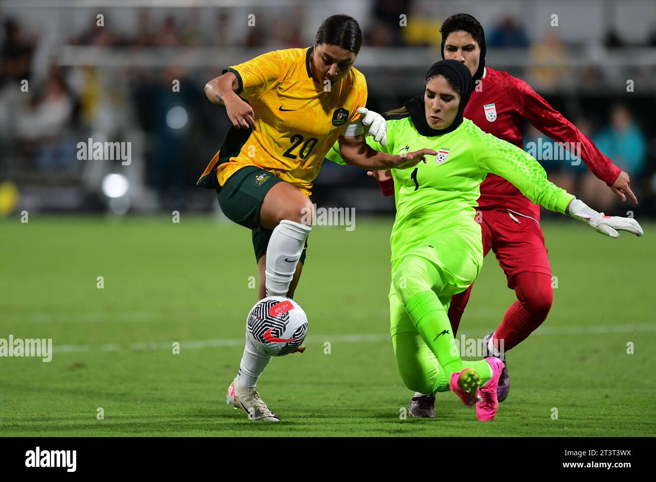 Perth, Australia. 26th Oct, 2023. Samantha May Kerr (L) of the Australia women's football team and Zahra Khajavi (R) of the Islamic Republic of Iran women's football team are seen in action during the 2024 AFC Women's football Olympic Qualifying Round 2 Group A match between Australia and Islamic Republic of Iran held at the Perth Rectangular Stadium. Final score Australia 2:0 Islamic Republic of Iran. Credit: SOPA Images Limited/Alamy Live News Stock Photo