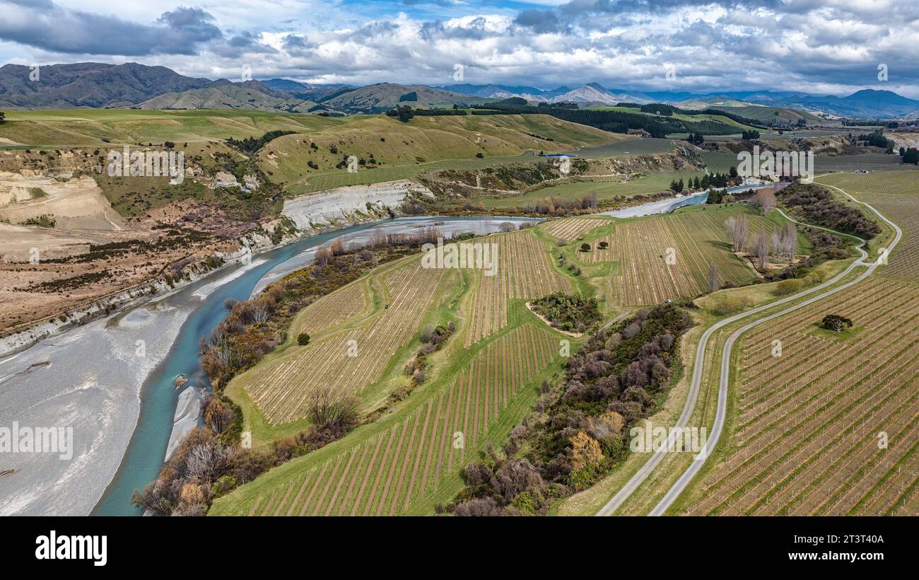 The blue water of the Awatere river flowing through agricultural ...