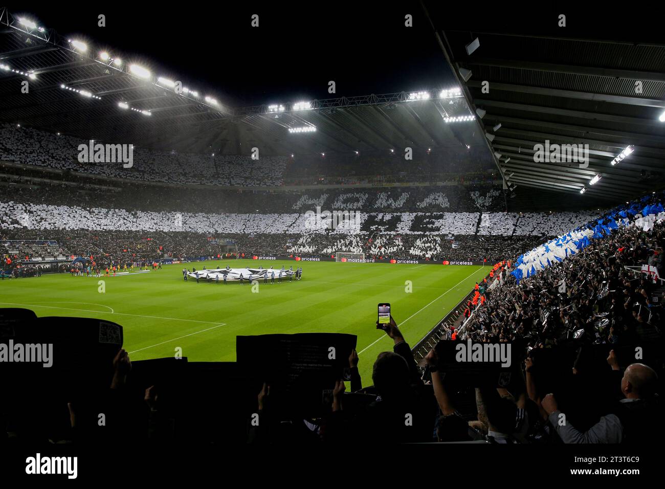 A general view of the flag display inside of the stadium as the teams come out at the start during the UEFA Champions League Group F match between Newcastle United and Borussia Dortmund at St. James's Park, Newcastle on Wednesday 25th October 2023. (Photo: Mark Fletcher | MI News) Credit: MI News & Sport /Alamy Live News Stock Photo