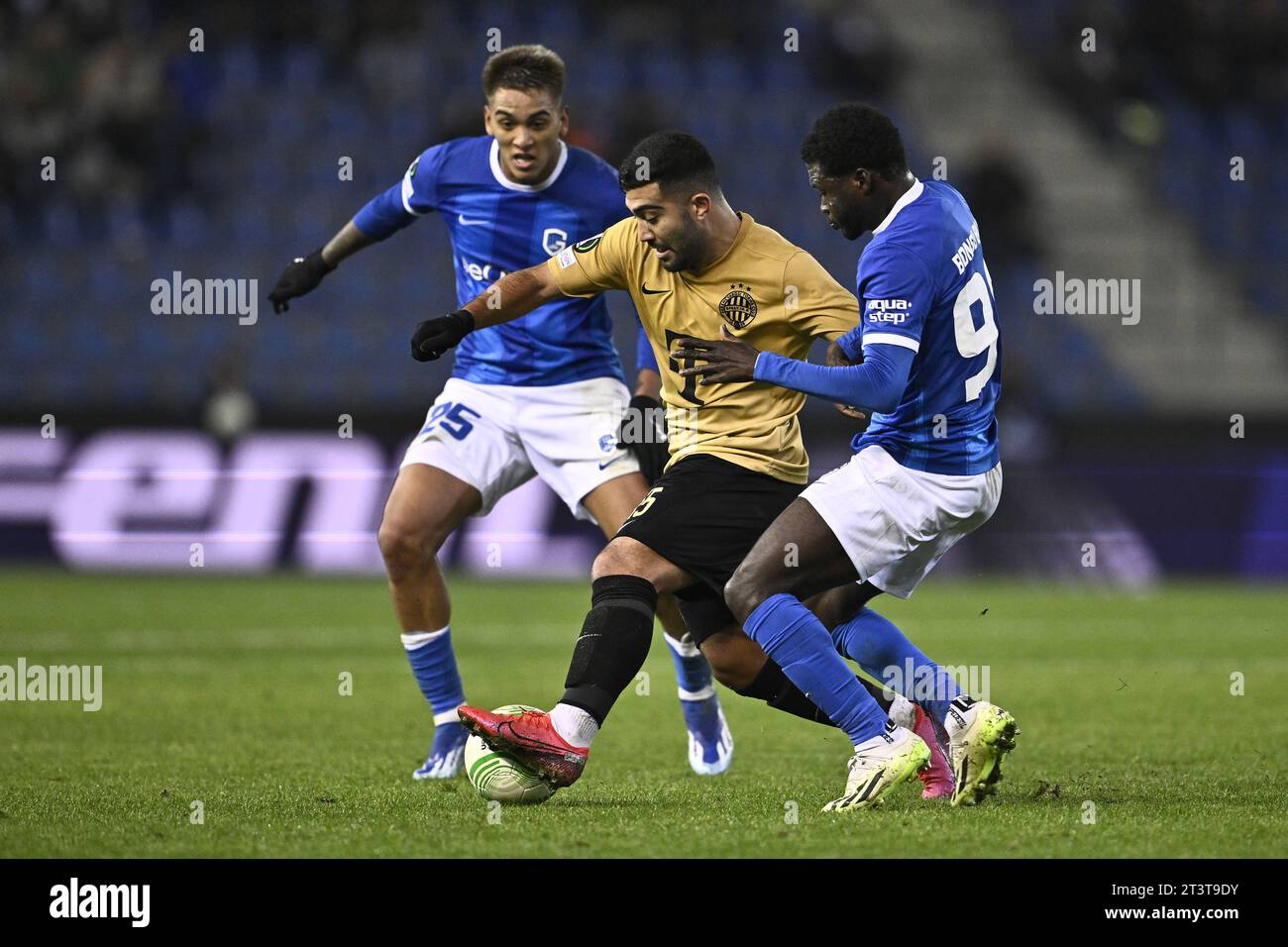 Genk, Belgium. 26th Oct, 2023. Genk's Matias Galarza, Ferencvaros' Mohammad Abu Fani and Genk's Christopher Bonsu Baah fight for the ball during a game between Belgian soccer team KRC Genk and Hungarian Ferencvaros, on Thursday 26 October 2023 in Genk, on day 3 of the group phase of the UEFA Conference League competition, in group F. BELGA PHOTO JOHAN EYCKENS Credit: Belga News Agency/Alamy Live News Stock Photo