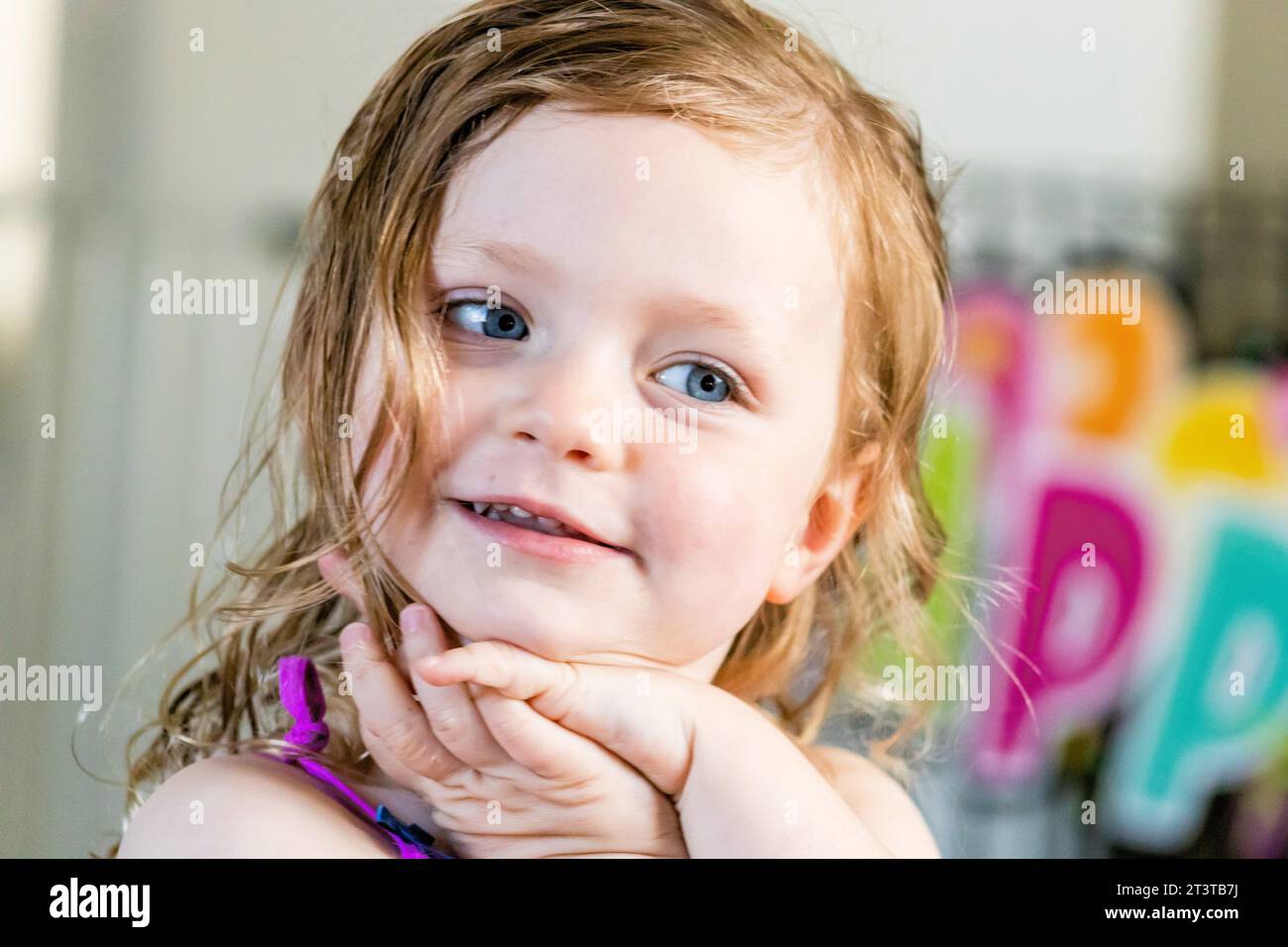 A 3 Year Old Girl Posing Cutely On Her Birthday Stock Photo Alamy a-3-year-old-girl-posing-cutely-on-her-birthday-stock-photo-alamy