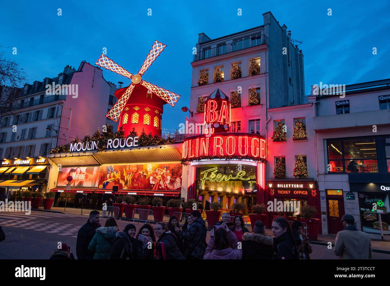 The Moulin Rouge windmill, Moulin Rouge is a famous cabaret built in 1889, located in the red-light district of Pigalle in Paris, France. Stock Photo