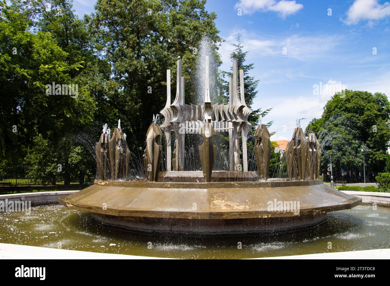 Water fountain on a summer day in the center of Carei, Satu Mare county, Romania Stock Photo