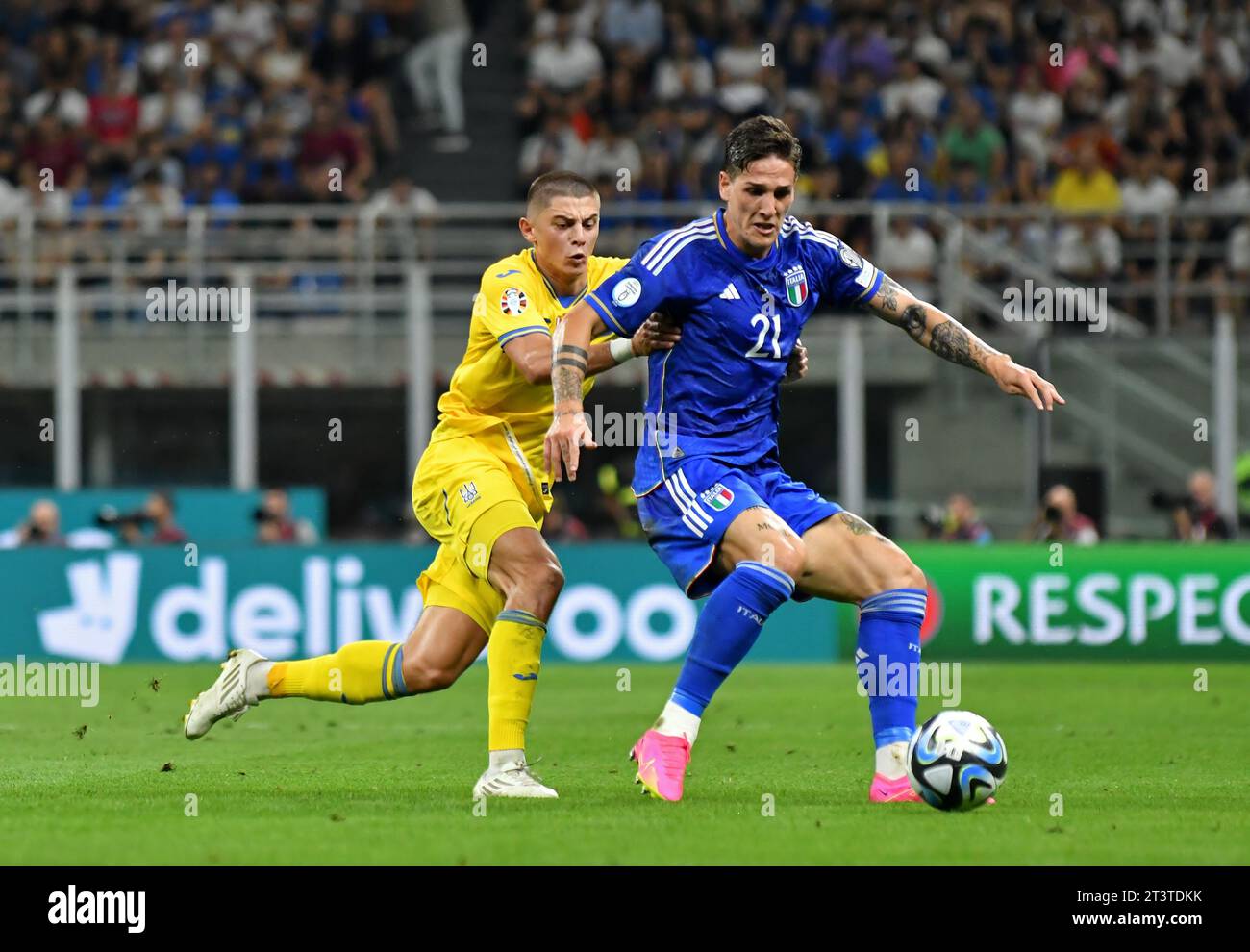 Milan, Italy - September 11, 2023: Vitaliy Mykolenko of Ukraine (L) fights for a ball with Nicolo Zaniolo of Italy during their UEFA EURO 2024 Qualifying game at Stadio San Siro. Italy won 2-1 Stock Photo