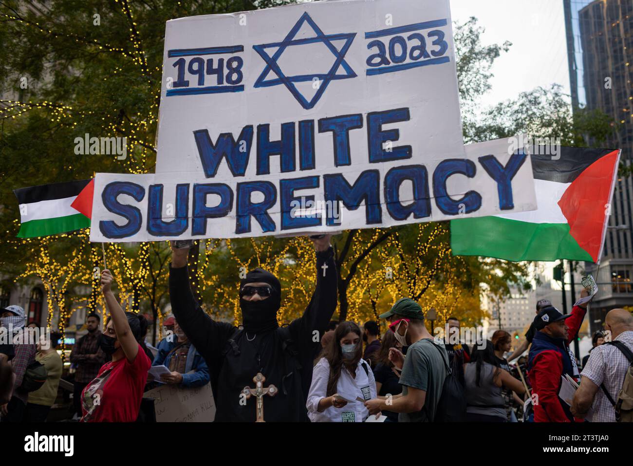 New York, USA. 26th Oct, 2023. NEW YORK, NEW YORK - OCTOBER 26: A pro-Palestinian protester holds a 'White Supremacy' sign during a rally held on Wall Street in support of Palestinians in Gaza on October 26, 2023 in New York City. The protest was against manufacturers and Wall Street firms investing and creating weapons used in the retaliation bombing of Gaza after the Palestinian militant group launched a deadly attack in southern Israel on October 7.(Photo by Michael Nigro/Sipa USA) Credit: Sipa USA/Alamy Live News Stock Photo