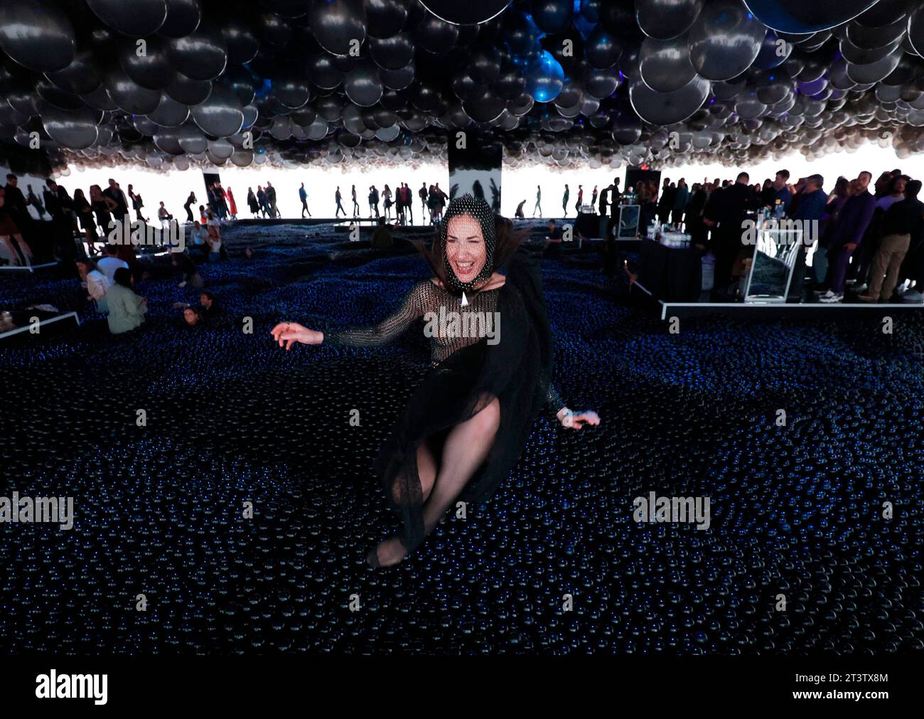 New York, United States. 26th Oct, 2023. Guests jump into the ball pit when they attend the