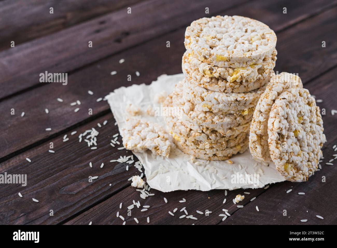 Pile puffed rice cakes brown wooden table Stock Photo Alamy