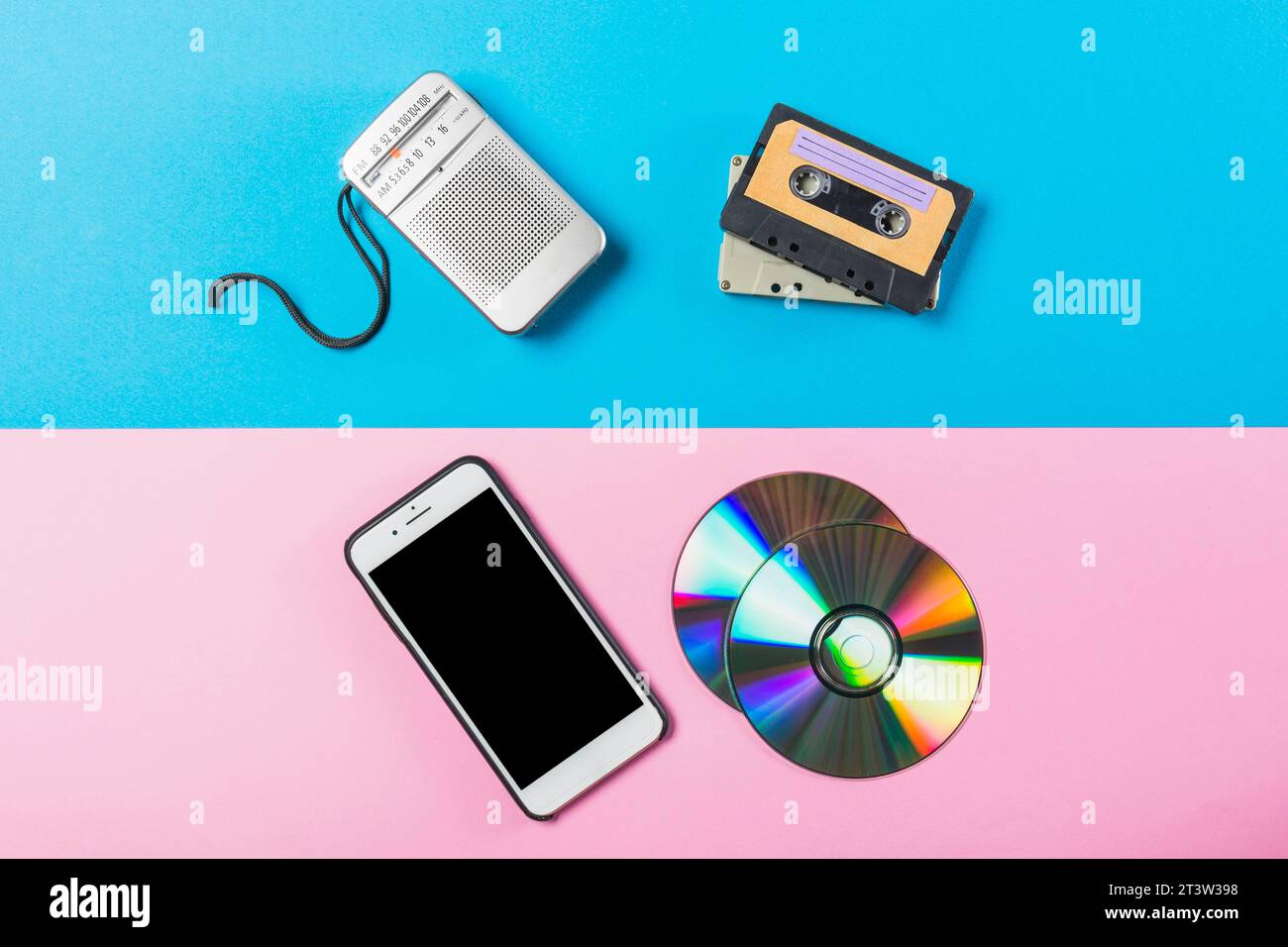 Radio cassette cd cell phone dual pink blue colored backdrop Stock