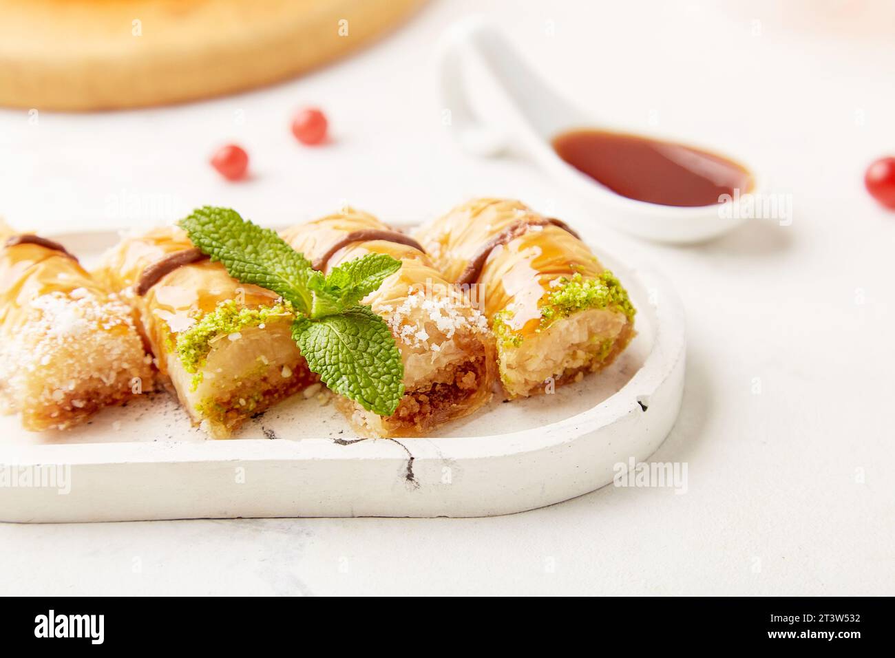 Close up of baklava - traditional turkish dessert with honey and mint. Natural sweets close up. Stock Photo