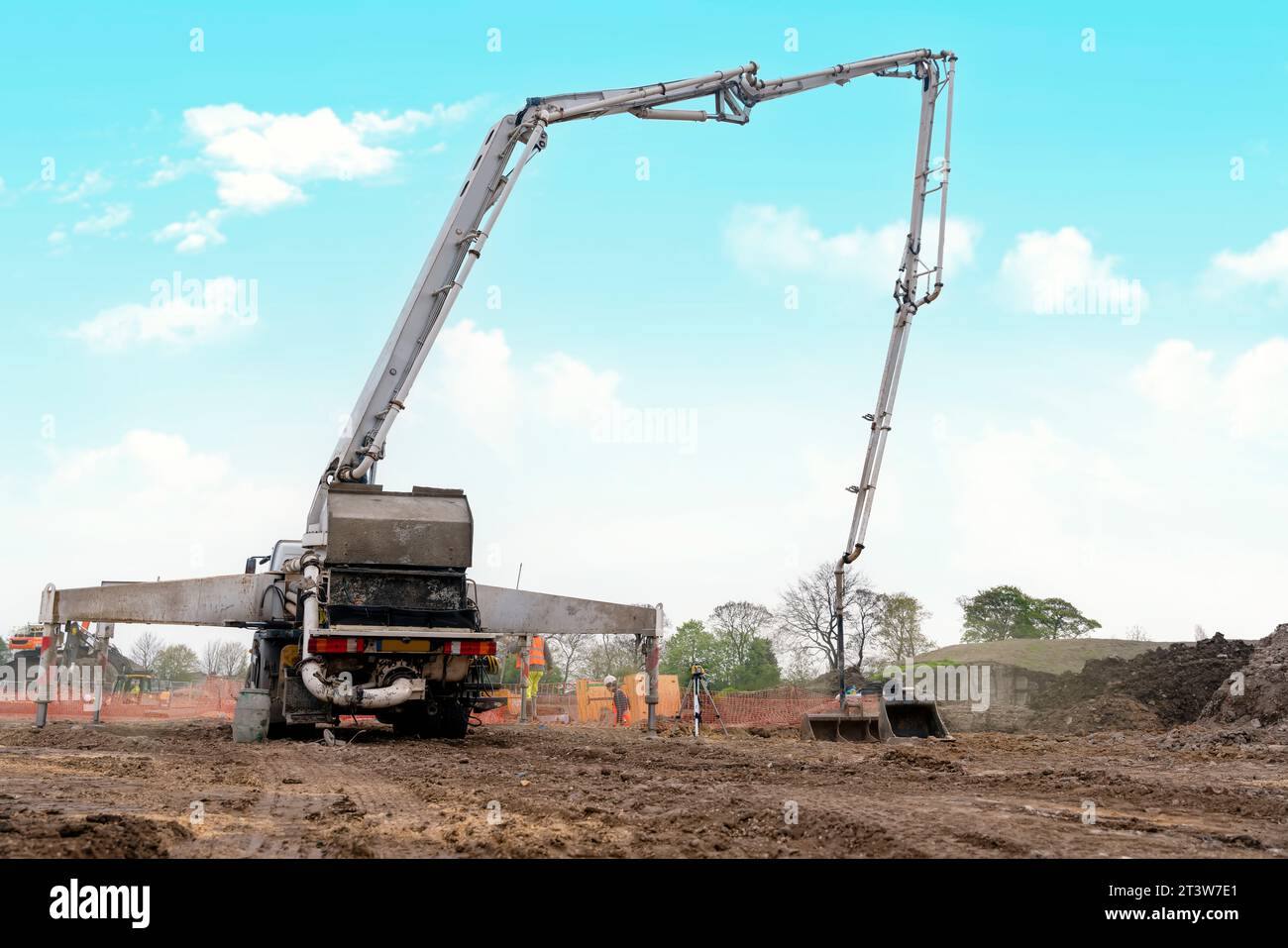 Concrete pump set on construction site awaiting concrete delivery Stock