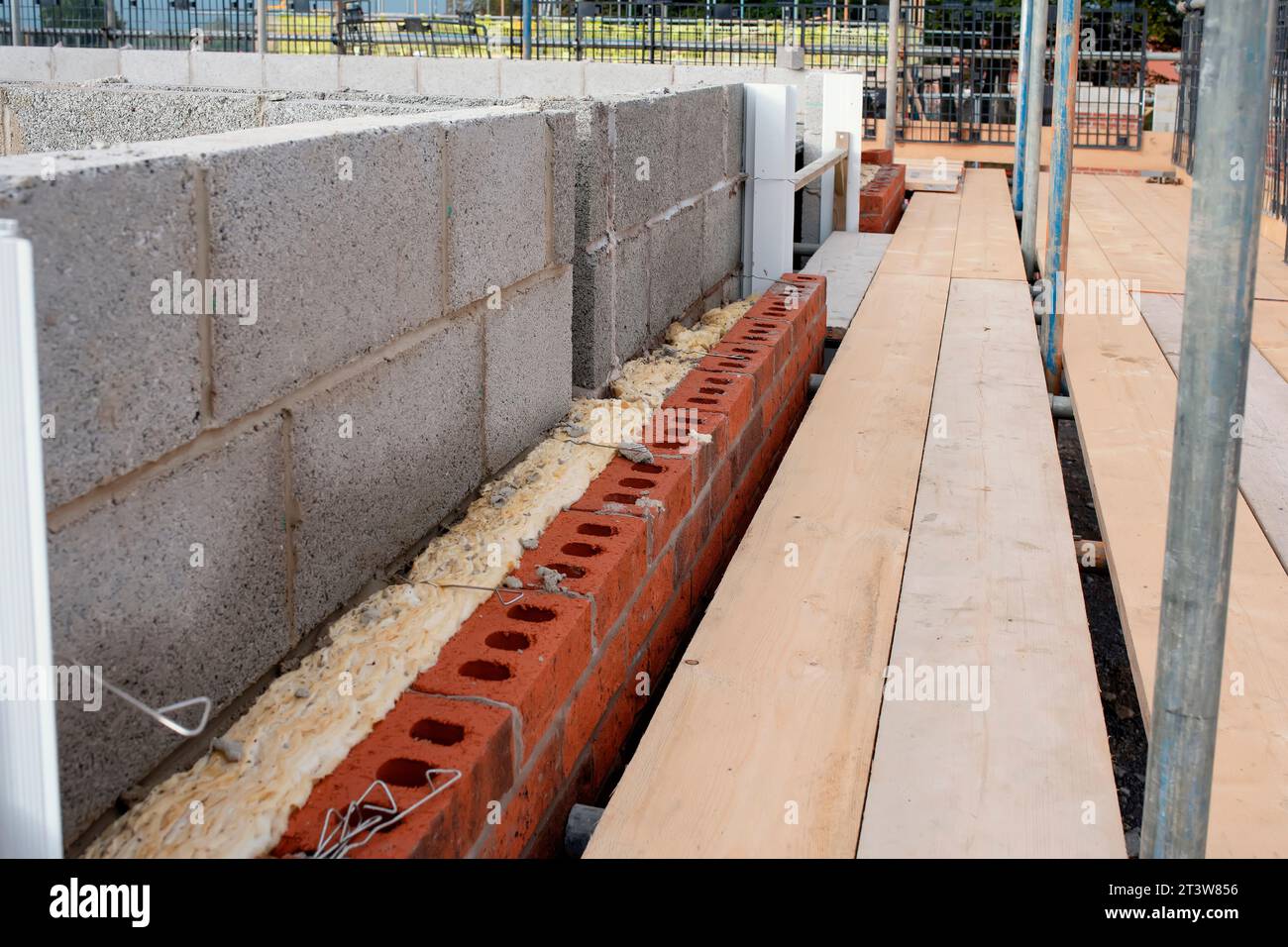Insulating walls of new build houses by placing rock wool inside wall