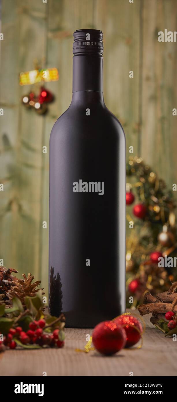 Christmas bottle of wine surrounded by Christmas decorations. Stock Photo