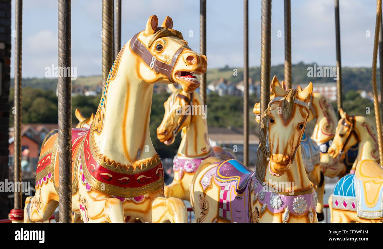 Riding around a horses carousel Stock Photo - Alamy