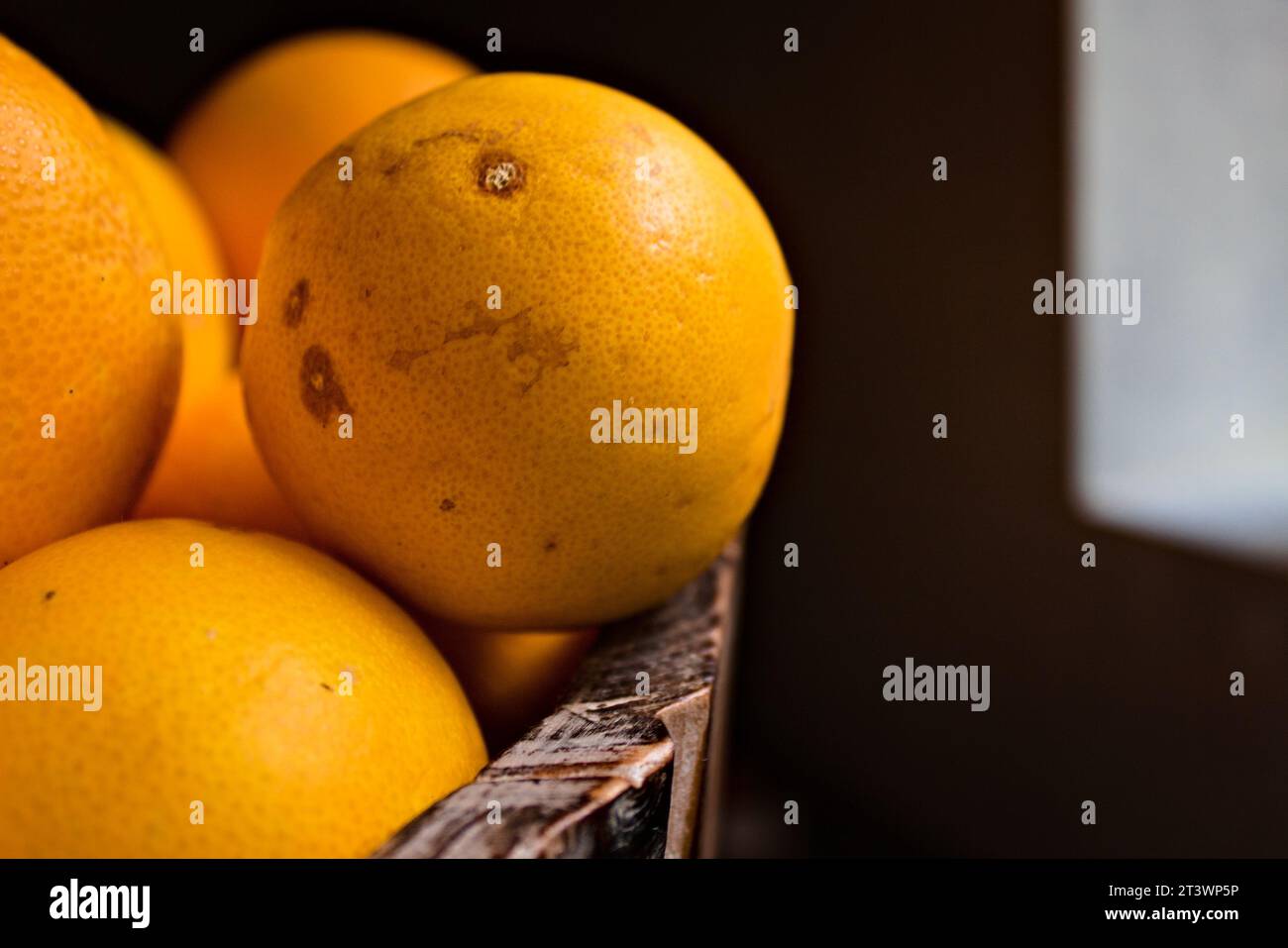 Fresh oranges in a wooden bucket Stock Photo - Alamy
