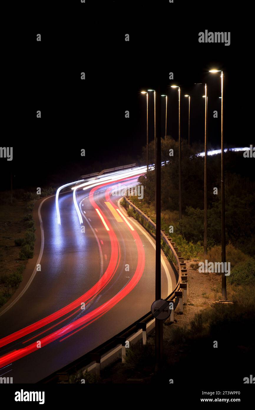 Road at night with light trails from cars in Almeria Stock Photo - Alamy