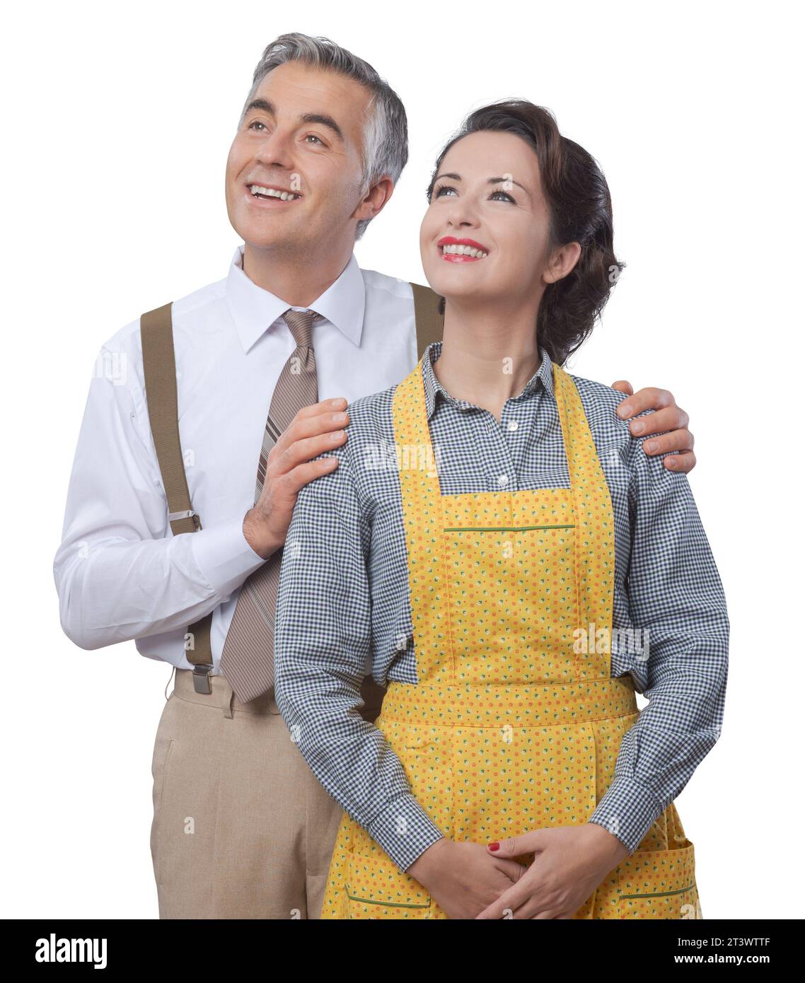 Happy vintage couple at home posing and smiling at camera Stock Photo