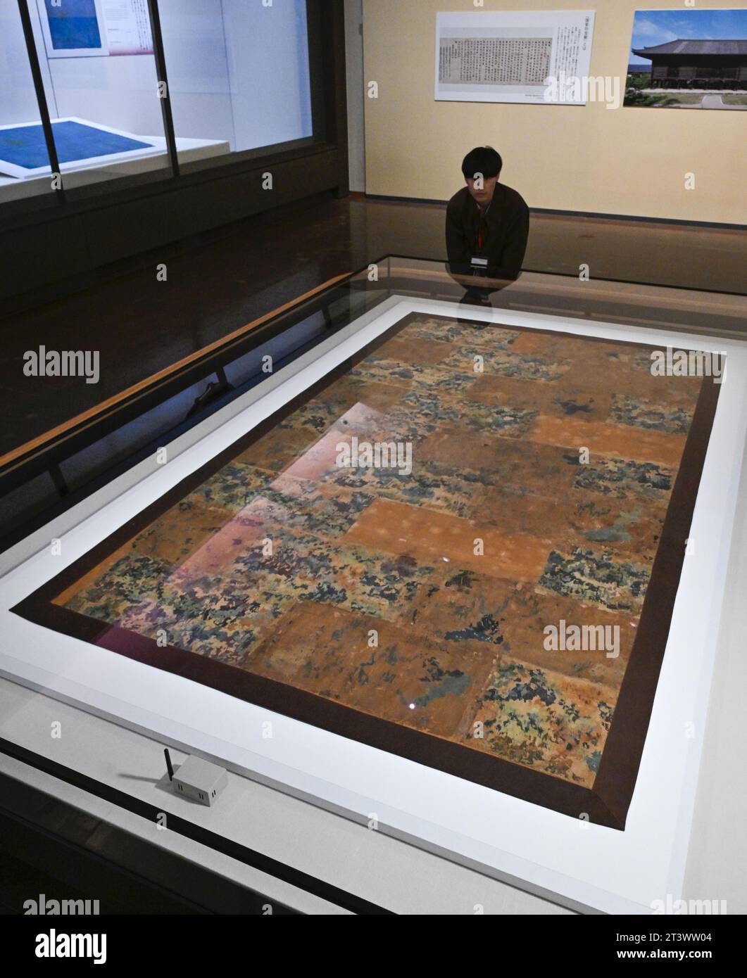 Photo shows a quilted priest s robe in nine strips of mottled colors in