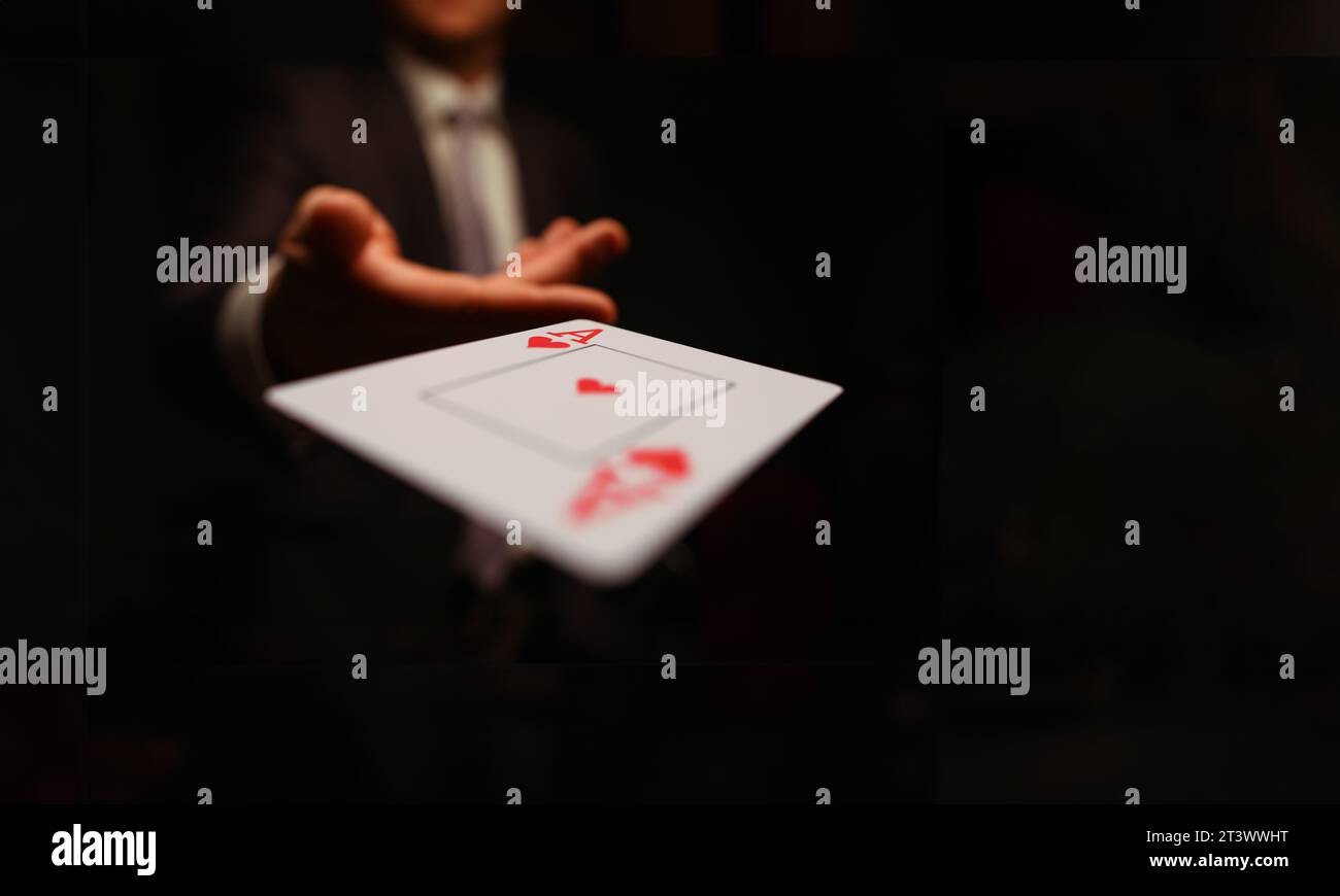 Businessman in suit throws his hand playing card ace Stock Photo Alamy