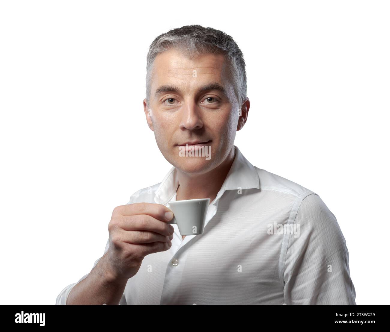 Handsome confident man having a coffee break and drinking espresso Stock Photo