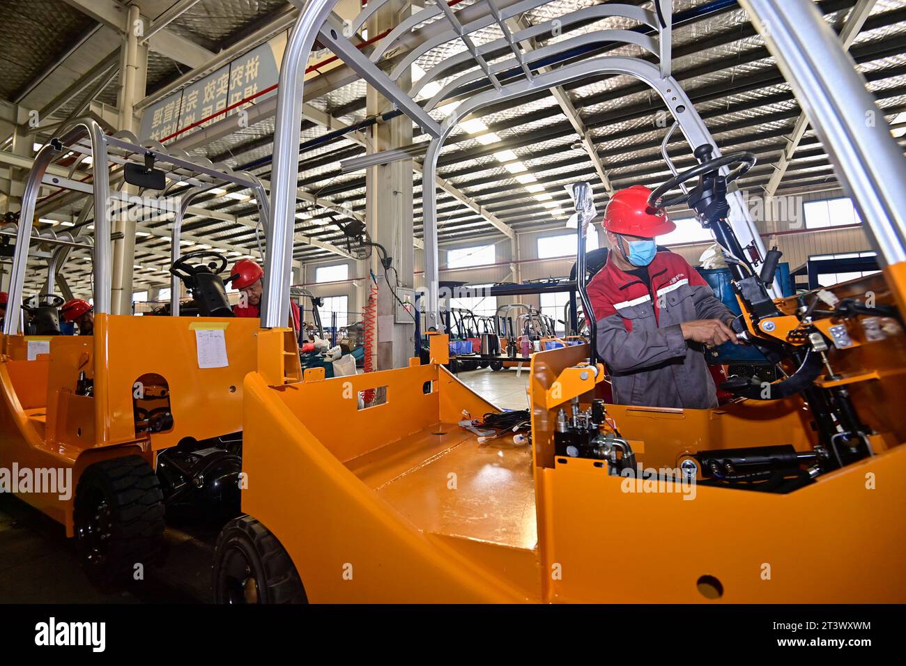 QINGZHOU, CHINA - OCTOBER 27, 2023 - Workers assemble electric ...