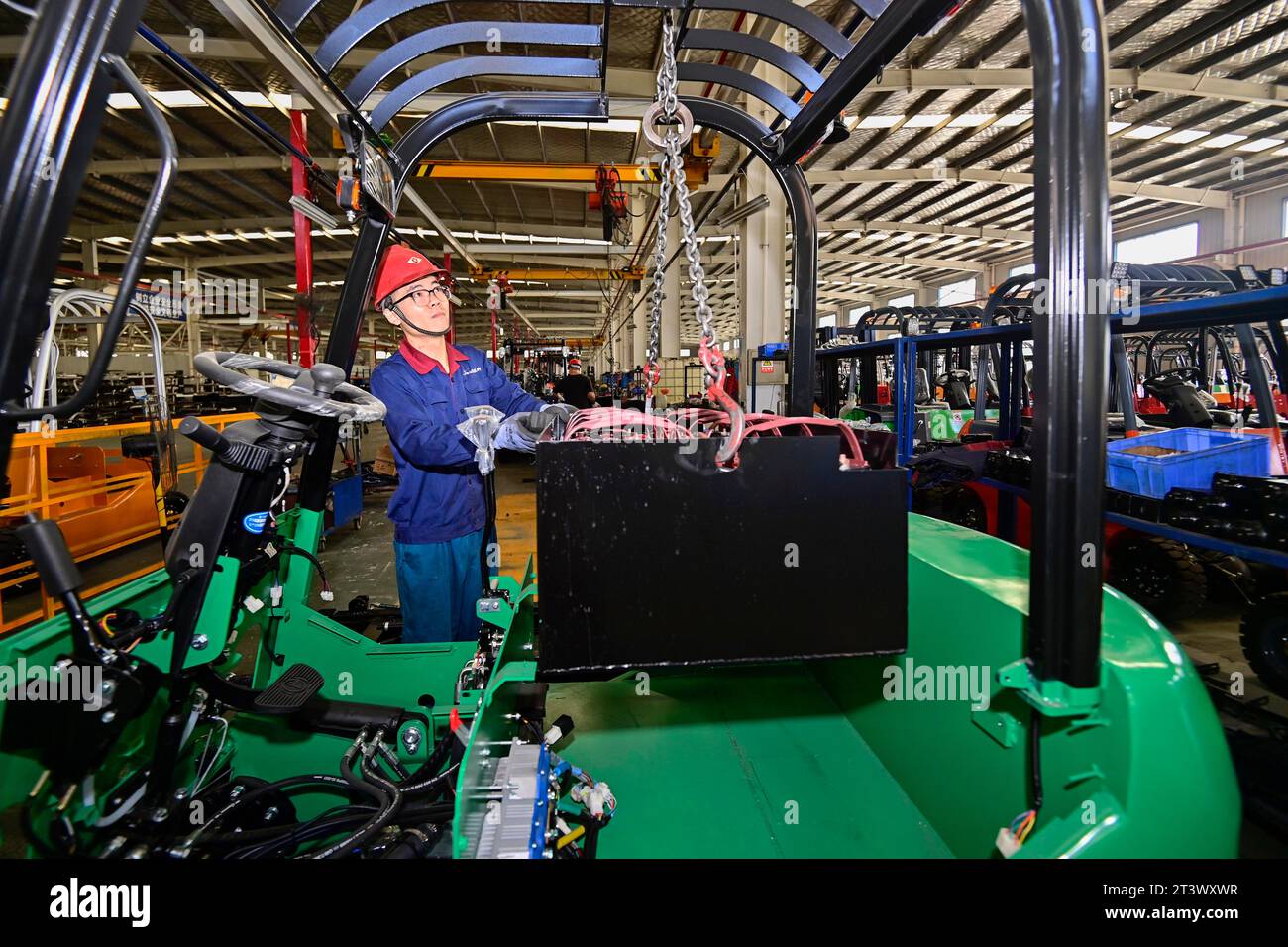 QINGZHOU, CHINA - OCTOBER 27, 2023 - Workers assemble electric ...