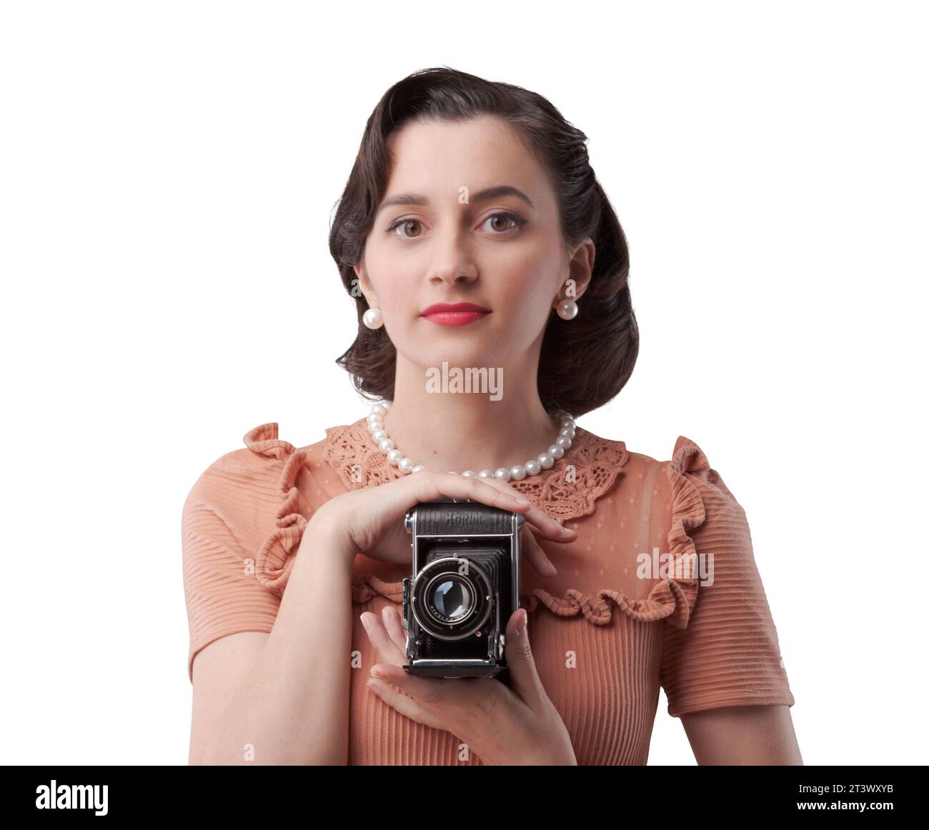 Beautiful elegant woman taking pictures with a vintage camera Stock Photo