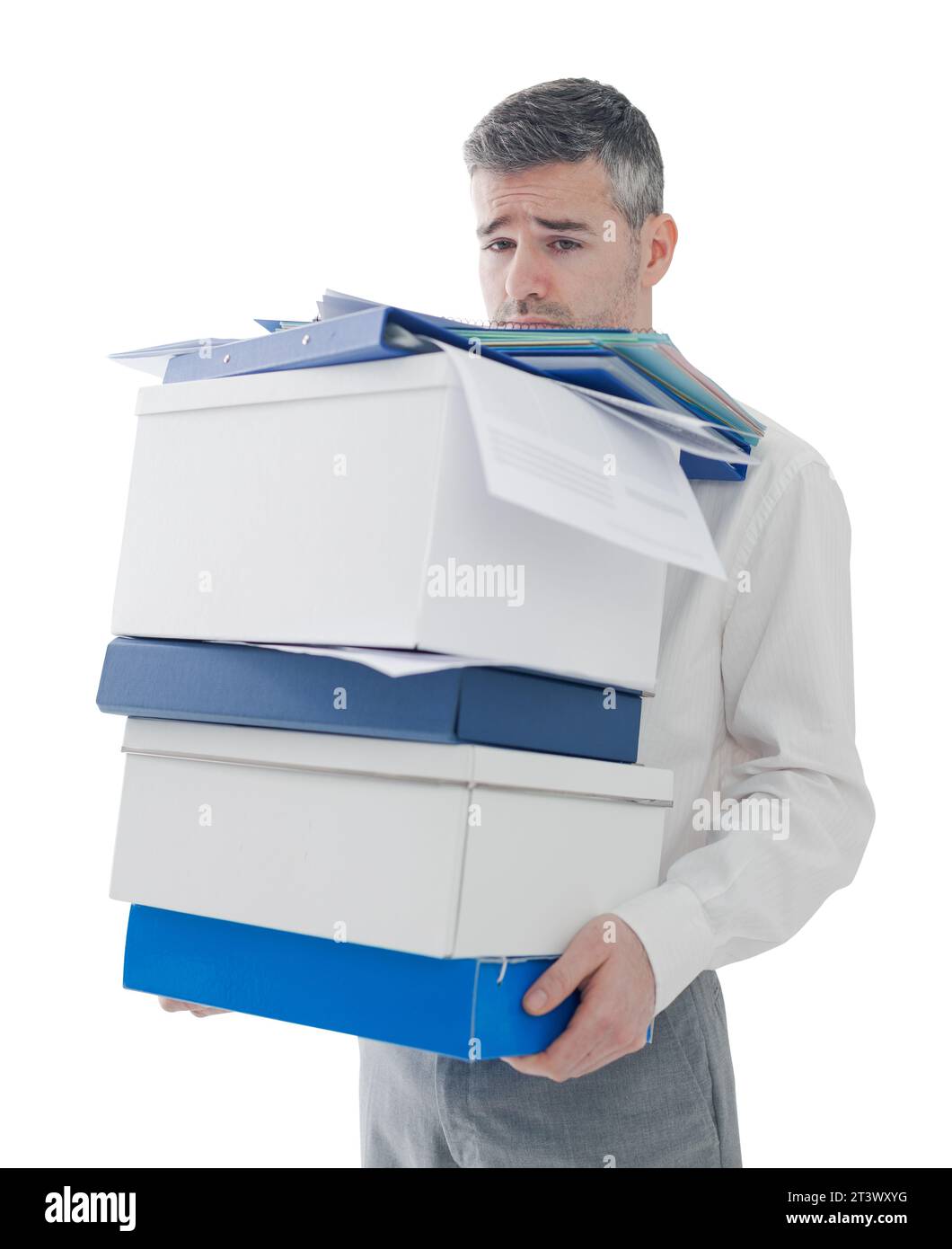 Frustrated sad businessman carrying a load of boxes and paperwork in the office, relocation, stress and responsibility concept Stock Photo