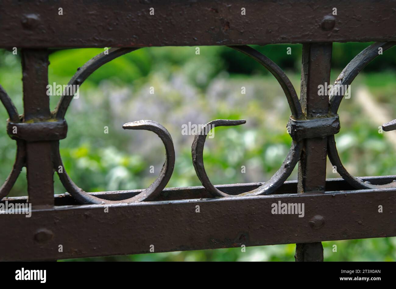 Metal fence with blurred background Stock Photo - Alamy