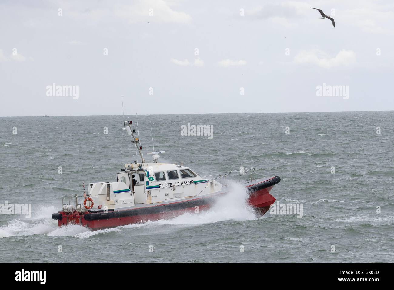 Le Havre, France - Pilot boat SAINTE CECILE outbound in stormy seas. Stock Photo